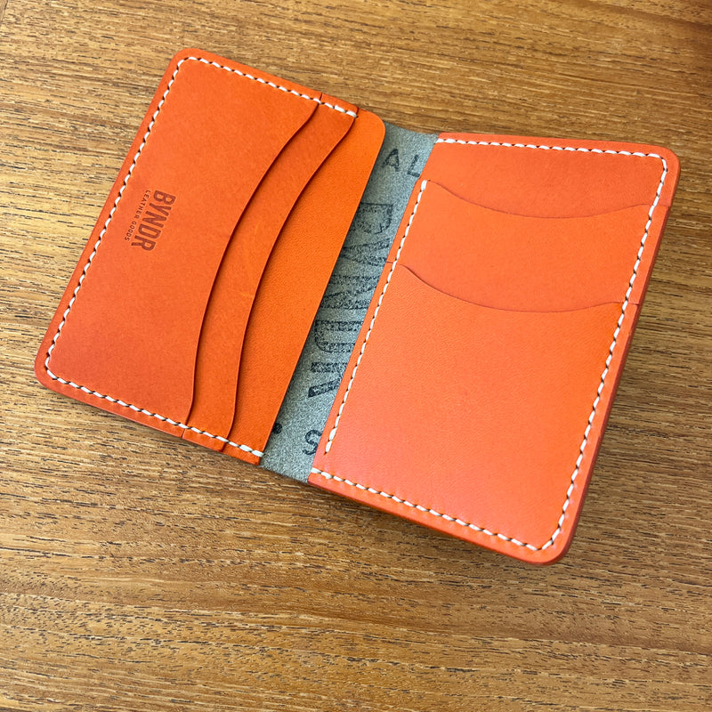 BI-FOLD - GREY PUEBLO + ORANGE